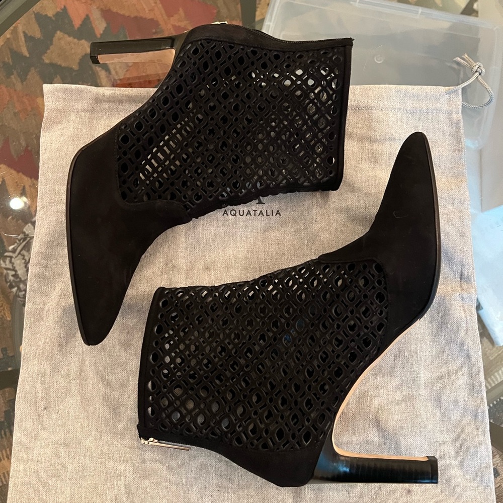 Aquatalia, laser cutout, spiked heel booties with back zipper. Black suede.